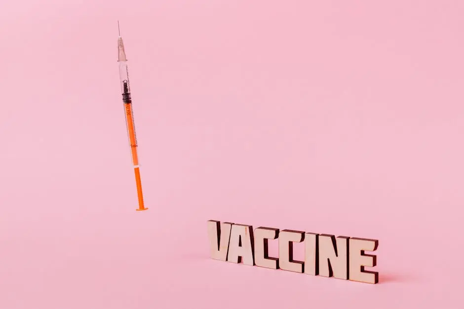 A wooden sign that says vaccine next to an orange syringe.